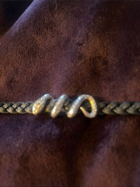Thai snake bracelet of silver and leather with gold accents.